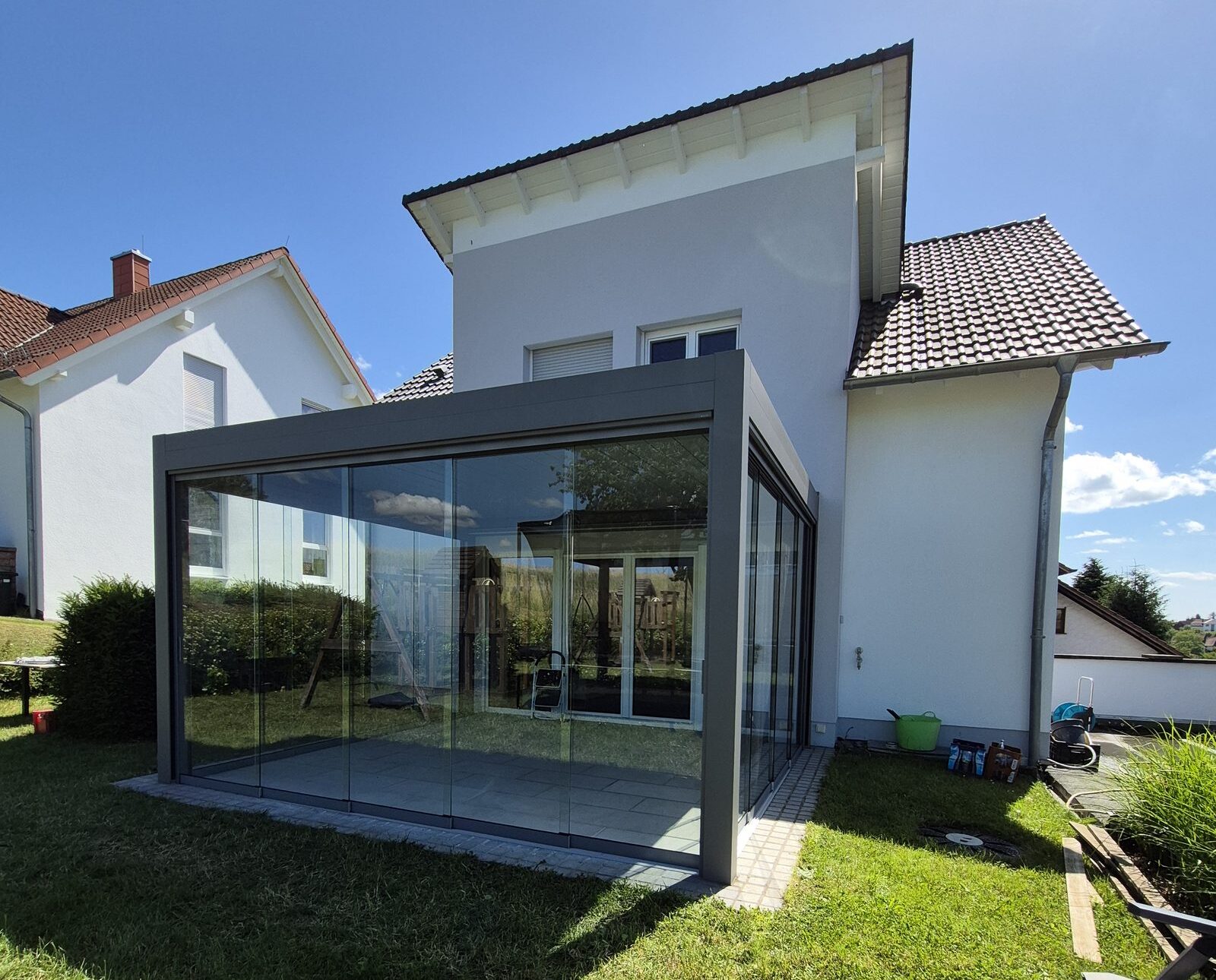 Pergola fermée par baies vitrées